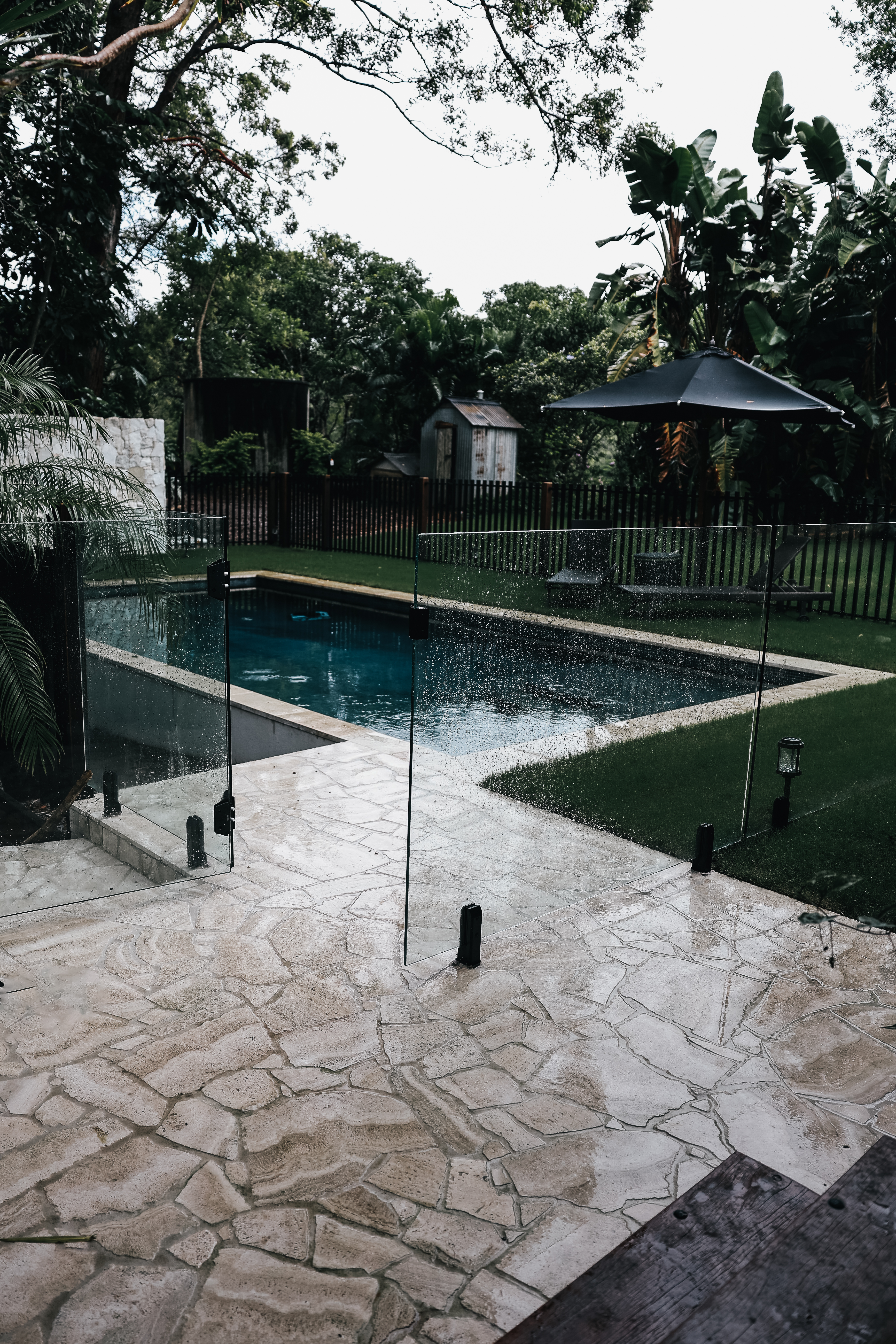 Glass-Fenced Garden Pool